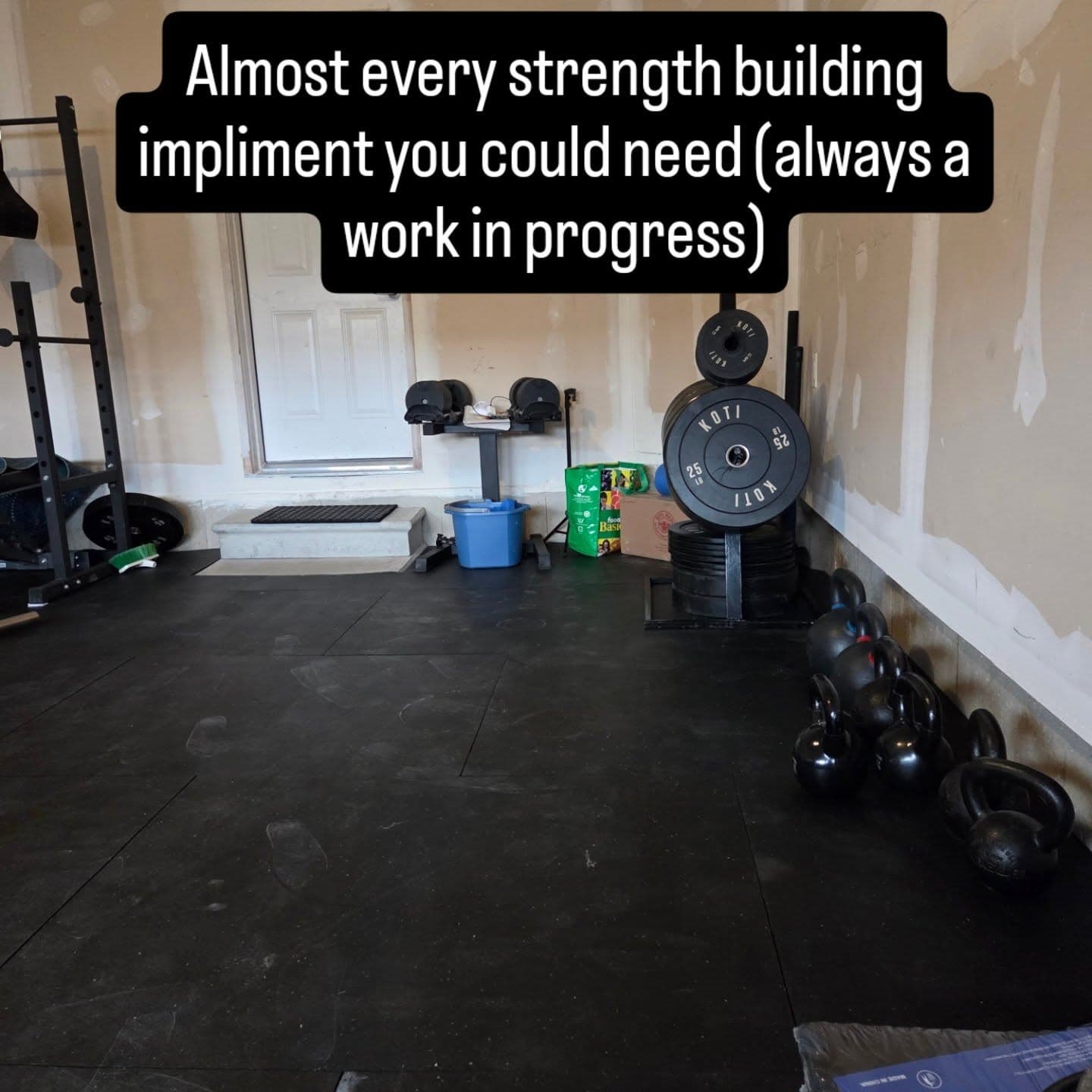 Rack of bumper plates and kettlebells at SWALL Fitness Caledonia